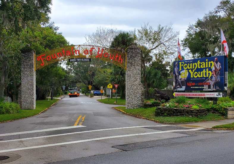 a sign over a street at the fountain of youth in St Augustine florida