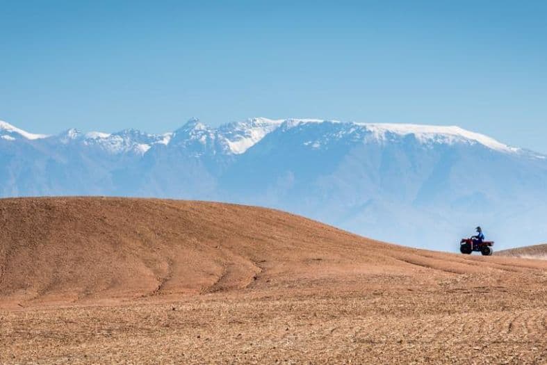An atv with the Atlas mountains in the background