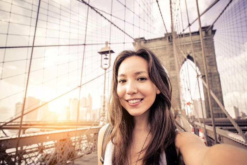 New york with teenagers on the Brooklyn Bridge
