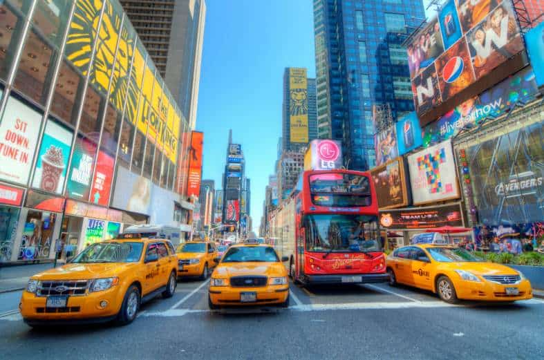 a double decker red sightseeing bus in time square New York City