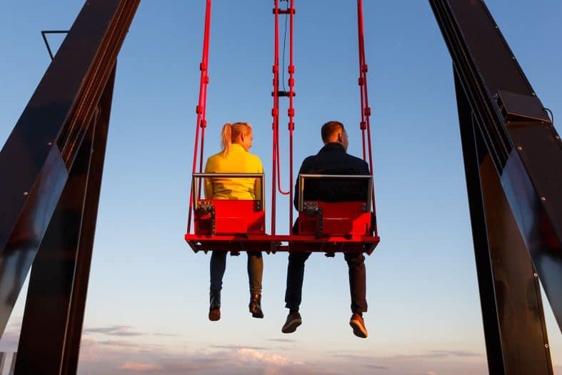 people sitting on the A'Dam swing