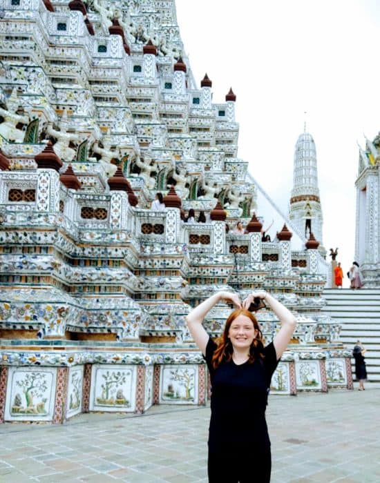 Teenagers in Bangkok visiting temples at Wat Arun.