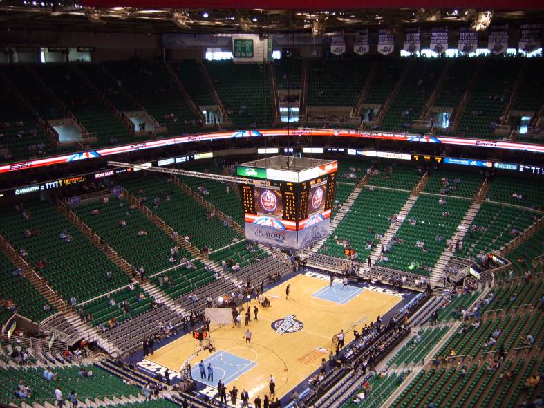 Teenagers cheering with excitement at a thrilling basketball game in the SLC Utah Jazz stadium