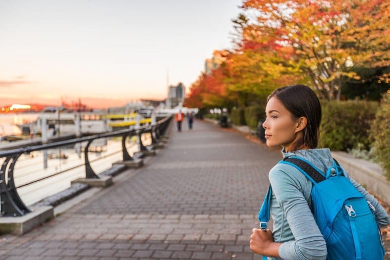 a girl walking the Seawall in Vancouver
