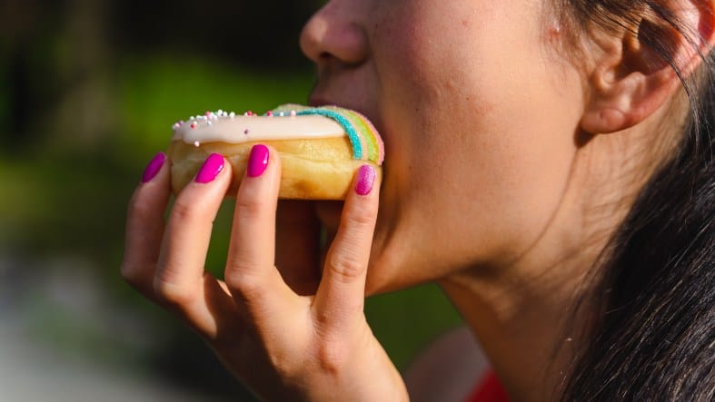 a teen in Vancouver eating donuts on a walking tour