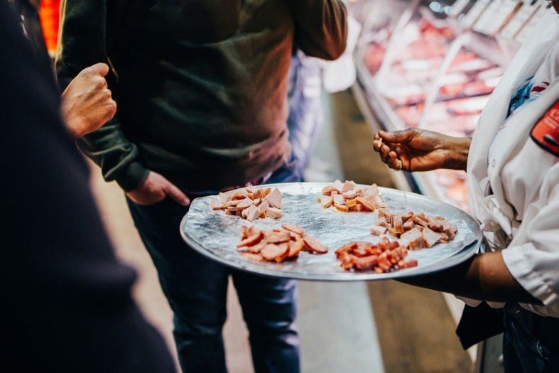 Tasting food on a food tour in Toronto