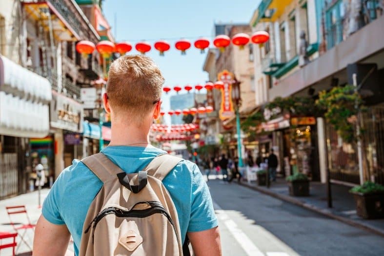 a teenage boy in Chinatown San Francisco exploring