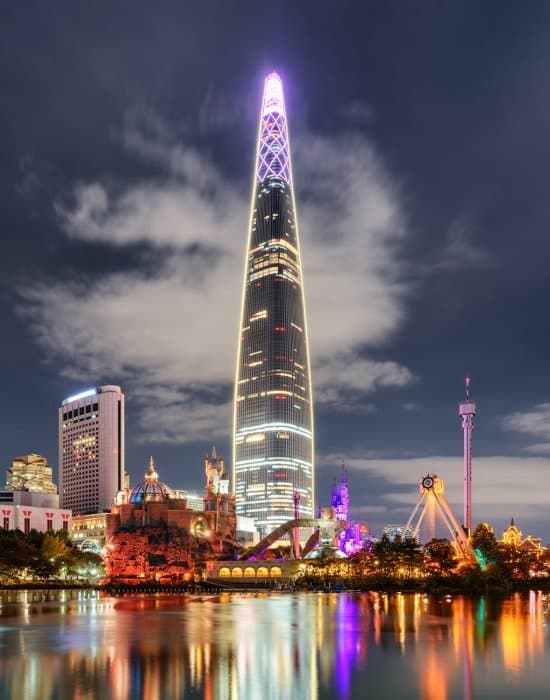 a roller coaster in motion at a popular theme park in Seoul, Lotte World