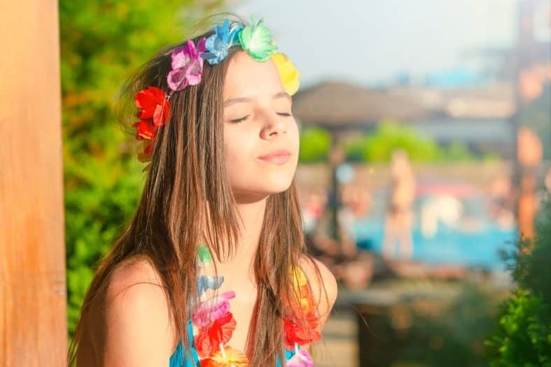 teenage girl in Tahiti enjoying the sun