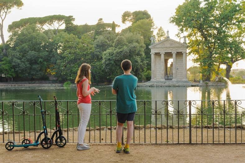 two teenagers embarking on a thrilling scavenger hunt in the streets of Rome