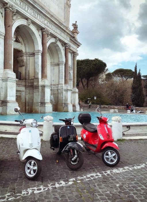 Vespa bikes parked in Rome