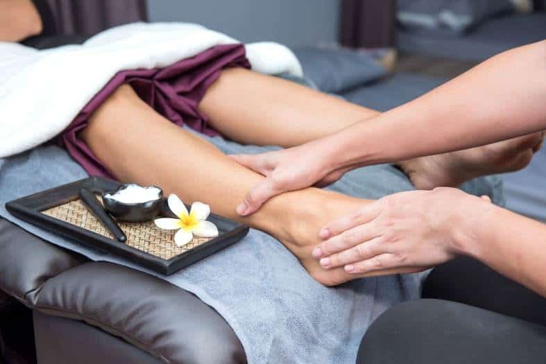 person receiving a therapeutic massage from a traditional Thai massage in Bangkok