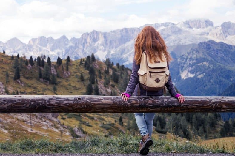 a teenage girl hiking in the alps of Italy