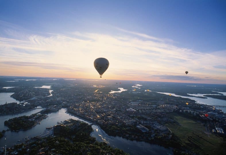 a hot air balloon floating over Stockholm