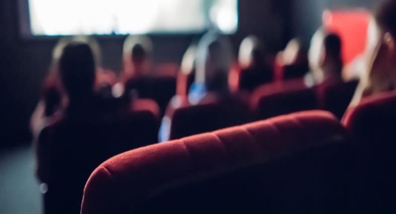modern cinema interior designed for teenagers, featuring comfortable seating and a vibrant ambiance