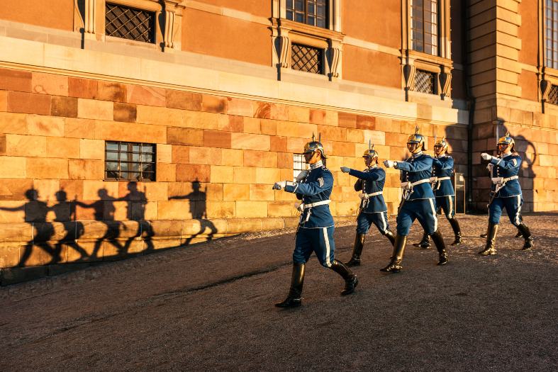 Guards marching down the street at the Royal Castle, It is a great sight to see in Stockholm with teenagers