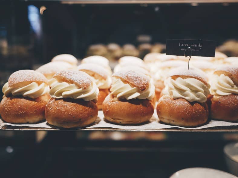 traditional Swedish Semla buns arranged on a plate as one of delightful treat associated with Stockholm's culinary culture.