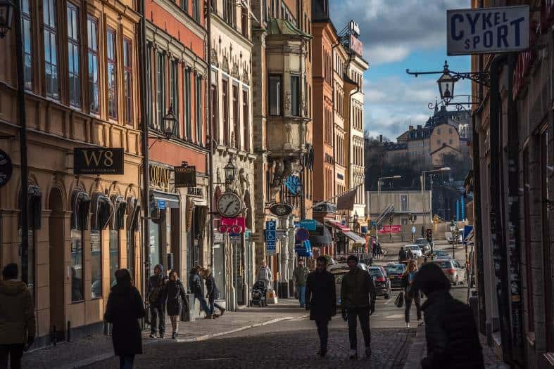 walking tour in Stockholm with a group of teenagers exploring the city's charming streets and landmarks on foot