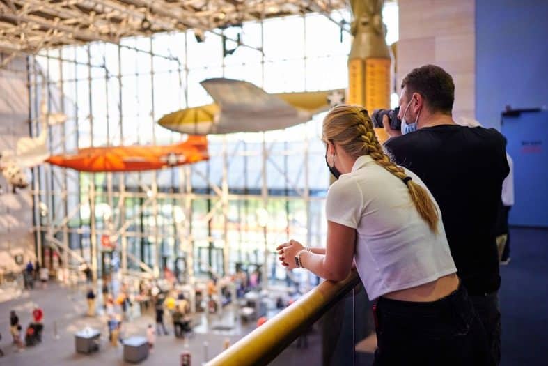 a father and daughter at the air and space museum in Washington, d.c with teenagers