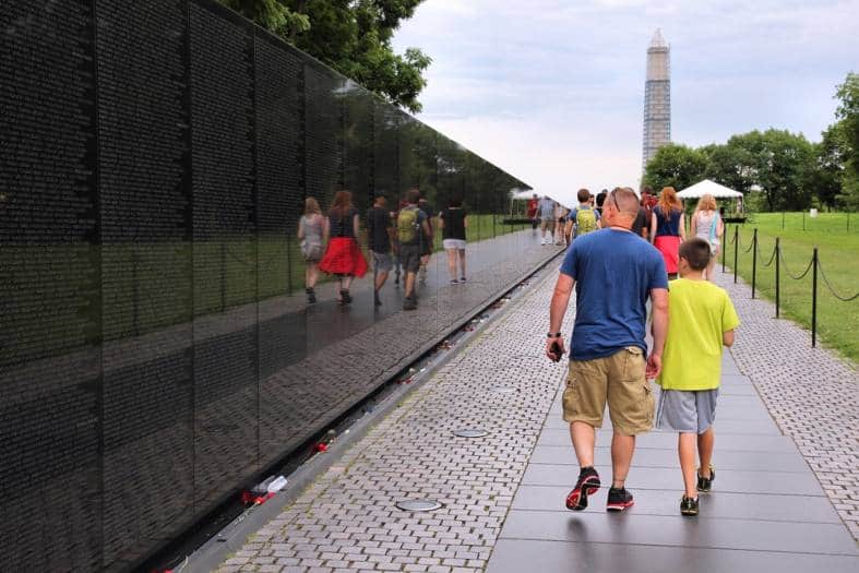 a father and teenage son walking around Washington D.C on a scavenger hunt