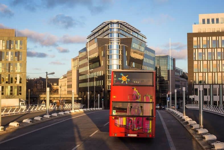 The red Berlin hop on hop off bus cruising the streets of Berlin