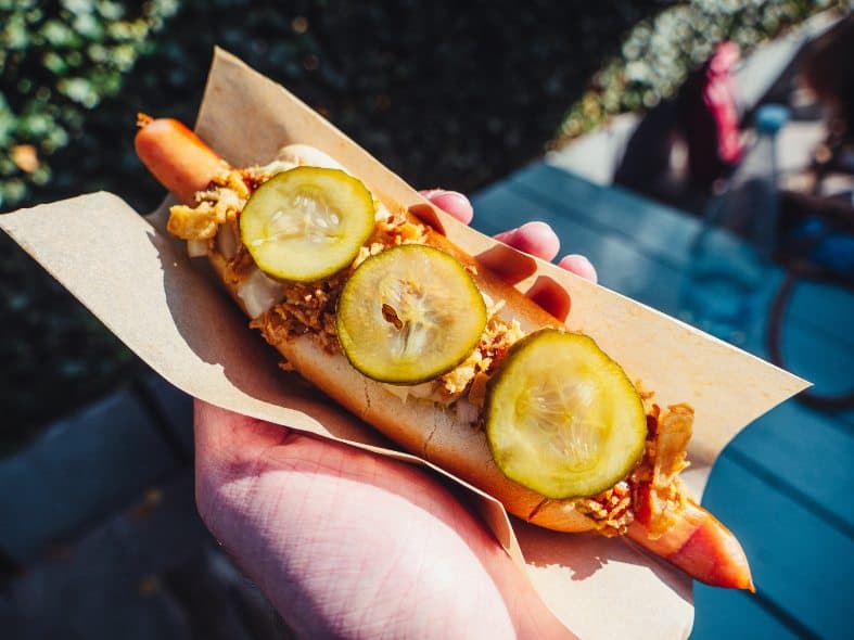 delicious Oslo hotdog, a tasty treat that a must-try while exploring the city with your teenagers