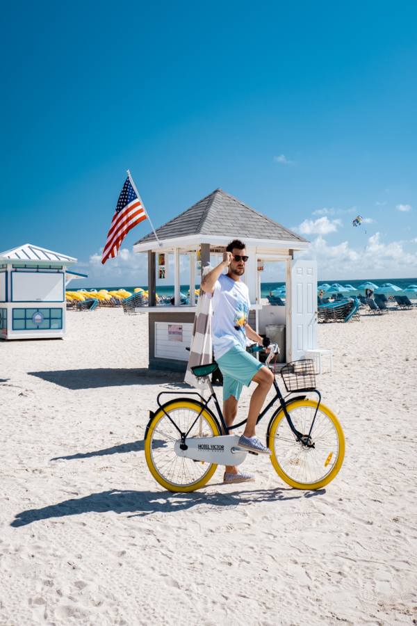 a teenage boy on a bike at Miami Beach in Florida