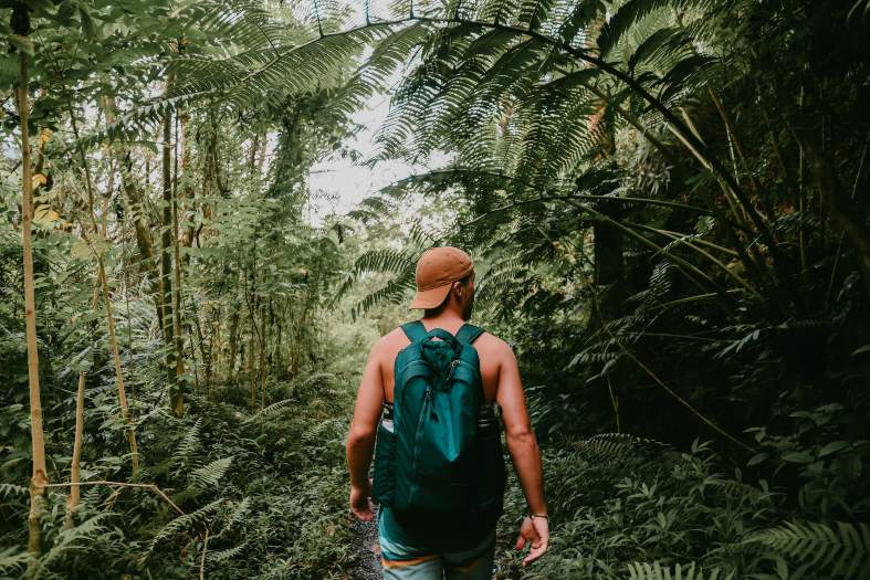 An older teen hiking in hawaii