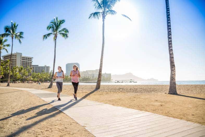 2 teenage girls jogging in hawaii