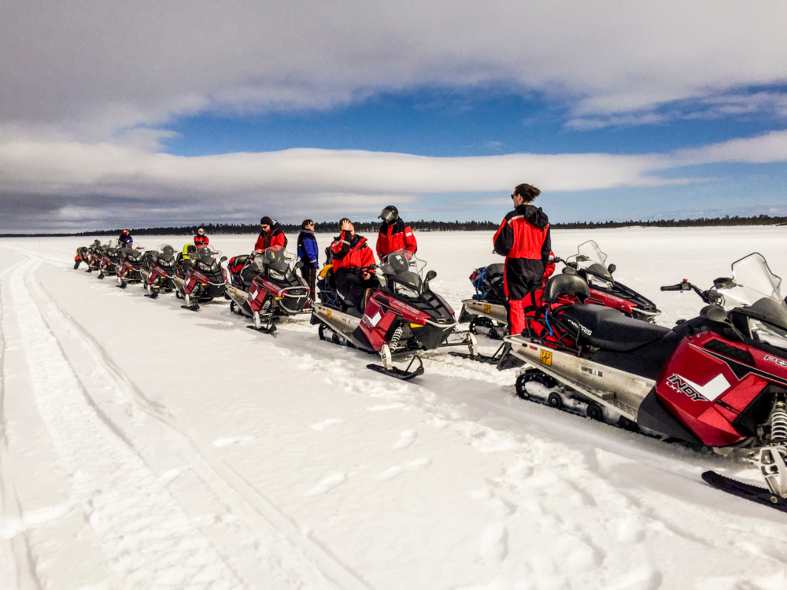 Having fun with snow mobiles near helsinki