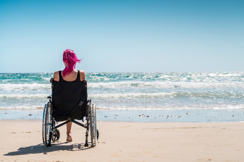 a teenager with a disability on the beach near Adelaide south Australia