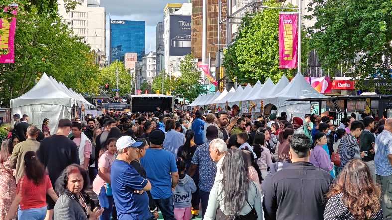 a large crown in queen st Auckland attending the annual Diwali Festival