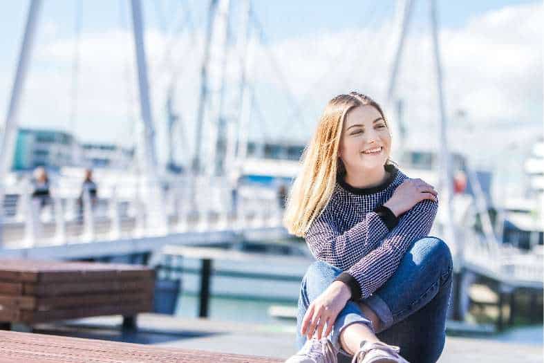 a teenage girl waiting at Auckland harbour to start a segway tour