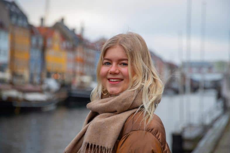 A blonde teenage girl in the Nyhavn area of Copenhagen