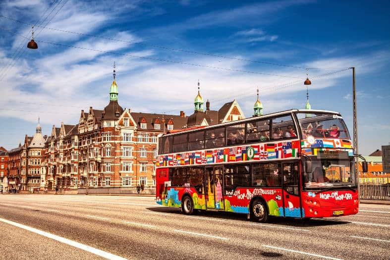Tourist bus in Copenhagen, offering a convenient and comfortable way to explore the city's attractions and landmarks with teenagers