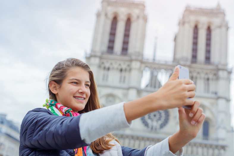 a teenager in Paris on her Mobile Phone