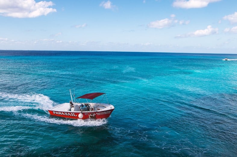 a parasailting boat in the blue waters off Cozumel in Mexico
