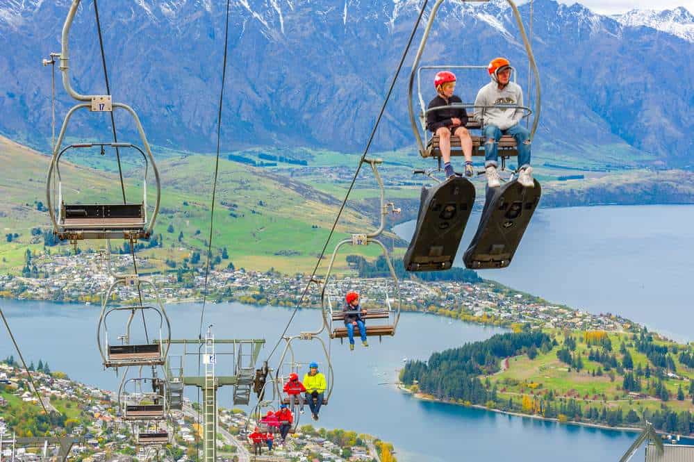 families on a chair lift at the sky luuge in Queenstown New Zealand