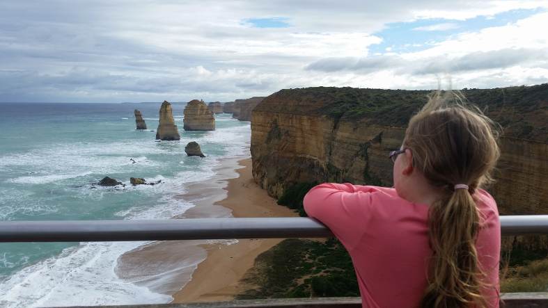 a youg girl looking at the 12 Apsotles on the Great Ocean Road in Victoria Australia