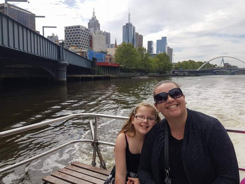 A mum and daughter on a boat on the Yarra River