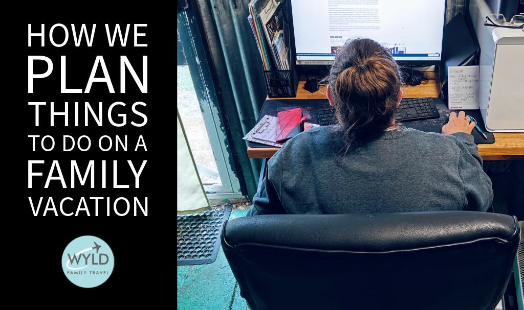 a lady sitting at a computer planning travel activities