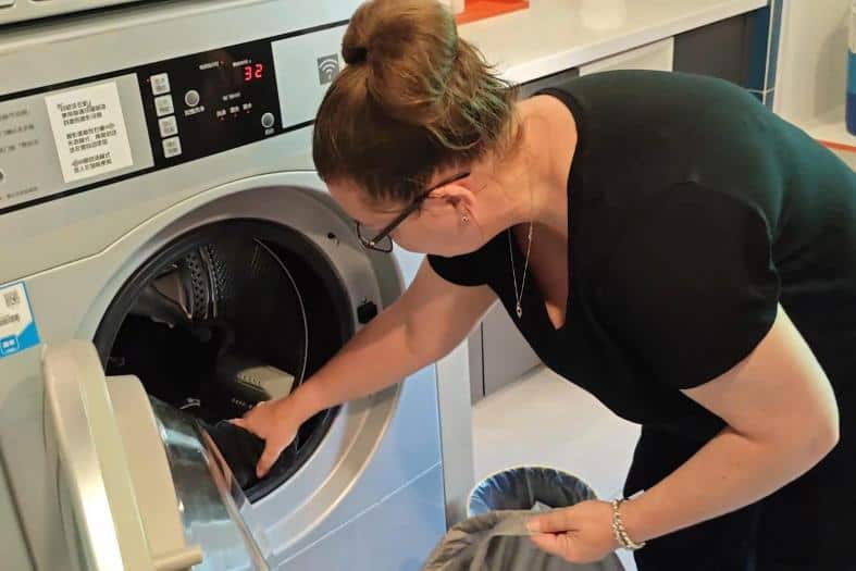 Bec doing the laundry at H.I Express Qingdao