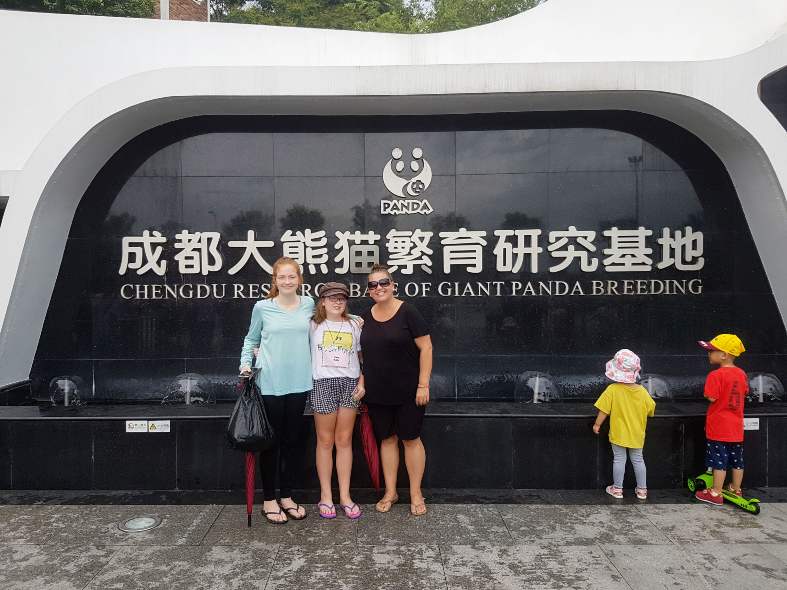 standing out front of the entrance to the Giant Panda breeding centre