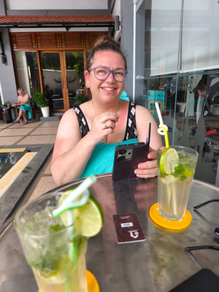Rebecca havinga cocktail by the ground floor pool